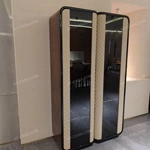 Rounded-Corner Dark Wood Wine Cabinet with Tinted Glass Doors Quilted Beige Upholstered Panels and Interior Shelving